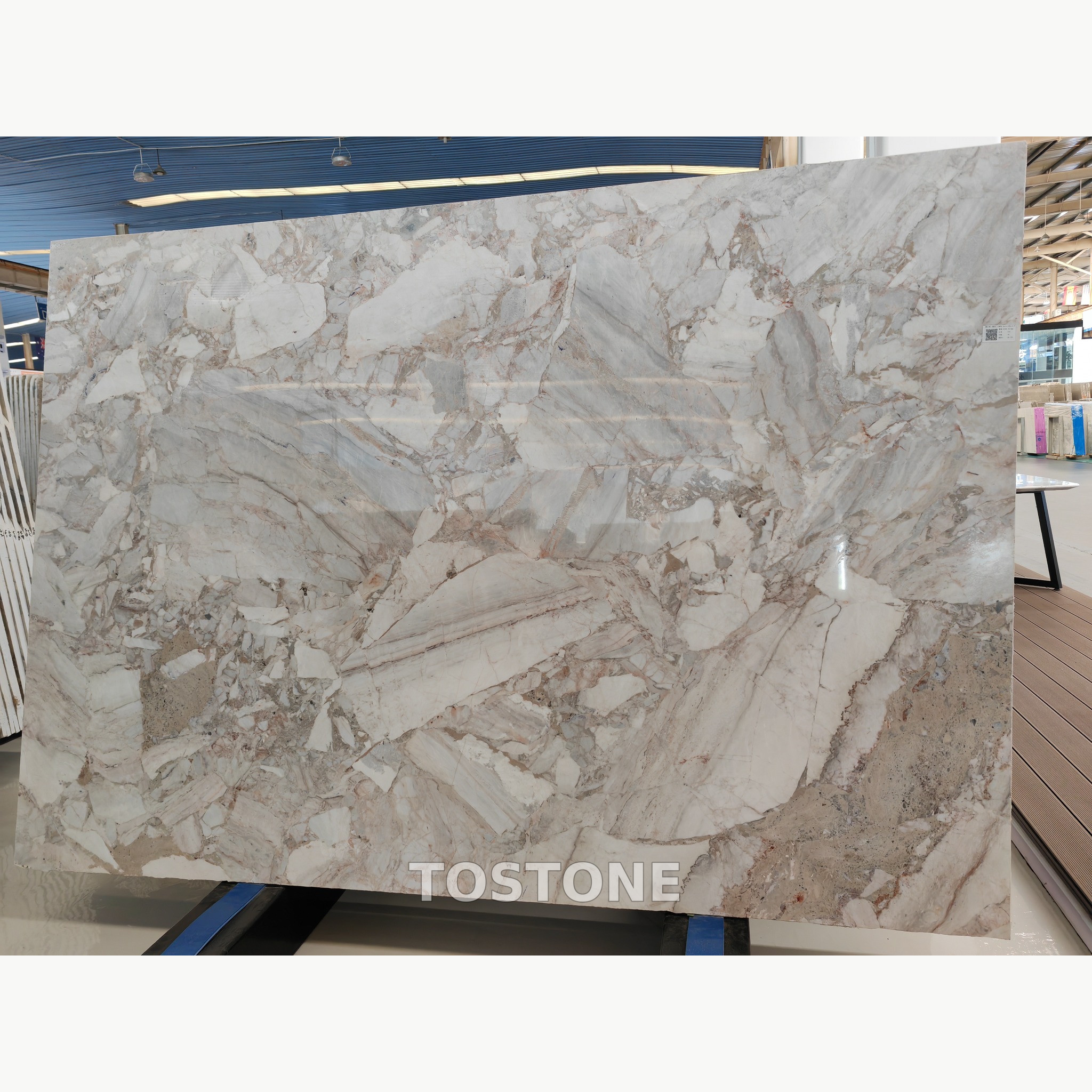 blossom-marble-01-partial-clean-square Full Blossom Marble slab with broad white and grey fragments and a blush-beige network of veining