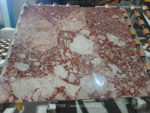 Blush Petals marble slab showing irregular cream areas within a rose-coloured network
