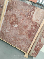 Angled view of Blush Petals marble slab bundle