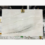 White Brazilian quartzite slab with sweeping grey veins and a bold charcoal band rising across the lower half.