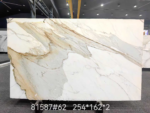 Calacatta Borghini marble full slab with sweeping grey and gold diagonal veins on a creamy white background
