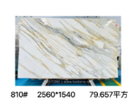 Calacatta Borghini marble slab with flowing diagonal grey bands and fine golden veins