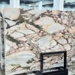 Vietnamese Calacatta Rosa marble slabs with pale pink and cream areas framed by dark veins