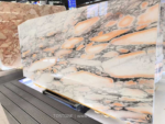 Angled Calacatta Rosa marble slab showing pink areas and branching grey veins