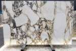 Front view of Italian Calacatta Viola marble slab with large ivory fields, deep plum-grey veins and gold accents