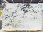 Calacatta Viola marble slab with expressive purple-grey diagonal veins and a broad light ivory field