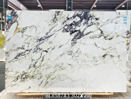 Calacatta Viola marble slab with expressive purple-grey diagonal veins and a broad light ivory field