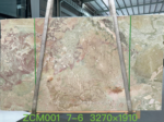 Detailed view of Italian Ceppo marble with sage green, rose and ivory fragments across a beige background
