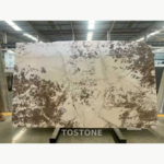 Cherry Blossom Pine Marble slab with a broad cream centre and dark brown branch-like markings around the edges