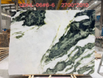 China Snow Green Marble slab with a white background and sweeping dark green mineral patterns
