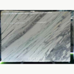 Desert Oasis Marble slab with diagonal charcoal-grey bands across an ivory and pale mint background