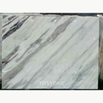 Desert Oasis Marble slab with an ivory-white field and long diagonal grey veining