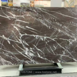 Espresso Vein marble slab with deep brown background and sweeping white veins