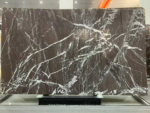 Espresso Vein marble slab with intersecting white veins over dark brown tones
