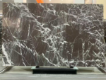 Espresso Vein marble slab showing a dense white vein network