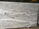 Front view of Fantasy Brown marble slab with flowing cream, grey and brown bands