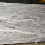 Front view of Fantasy Brown marble slab with flowing cream, grey and brown bands