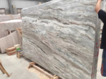 Angled view of Indian Fantasy Brown marble with sweeping layered movement