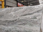 Close view of grey and cream wave patterns in Fantasy Brown marble