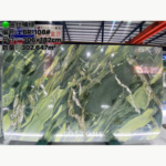 Golden Silk Green Marble slab with deep green fields, yellow-green ribbons and white veins, with the original image overlay.