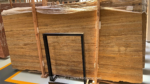 Front view of Golden Travertine slabs with fine brown and gold bands