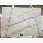Guangxi White Marble slab with flowing diagonal gray veins, marked B
