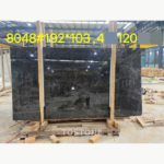 Wide Hermes Grey Marble slab showing dark grey tones, fine pale veins and a reflective surface.