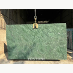 Indian Large Flower Green Marble slab in sunlight with dark branching lines and pale green mottling