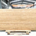 Front view of Iran Beige Travertine slab with warm sand-coloured layers