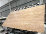 Angled view of Iran Beige Travertine slab during processing