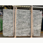 Front view of Iranian Green Marble slabs with dense grey-green waves and white branching veins