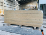Italian Silver Travertine slab in a workshop with fine grey linear markings