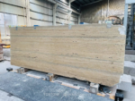 Angled view of Italian Silver Travertine vein-cut slab