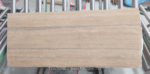 Italian Silver Travertine sample slab with warm beige tones and narrow grey bands