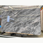 Angled view of Italian Space Grey Marble with dense diagonal silver-white and charcoal movement across the slab.