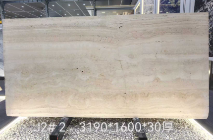 Italian Super White Travertine Vein Cut Slab displayed upright with pale cream horizontal layers