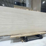 Wide angled view of Italian Super White Travertine Vein Cut Slab with fine ivory and beige bands