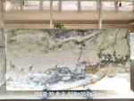 Italian Toscana marble slab with branching grey veins and warm golden accents