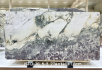 Italian Toscana marble slab with pale cream areas and a dramatic dark grey section
