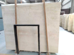 Ivory Travertine slab bundle displayed in a workshop