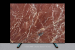 Kadiya Red Marble full-slab display against a dark background