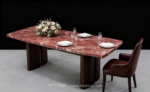 Design reference showing a red marble dining table with white veins and dark chairs