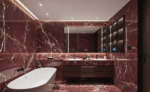 Bathroom design reference with burgundy marble walls, floor and vanity beside a white bathtub