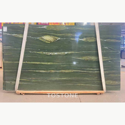 McLaren Green Marble slab secured by lifting straps, with dark green horizontal lines and olive-gold bands