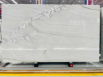 Mont Blanc quartzite slab with sweeping white movement across pale grey