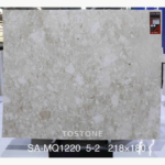 Front view of a Montage Marble slab with pale cream, ivory and taupe mosaic-like patterning