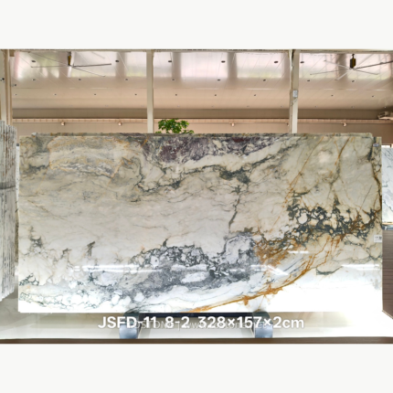 Italian Toscana marble slab with branching grey veins and warm golden accents