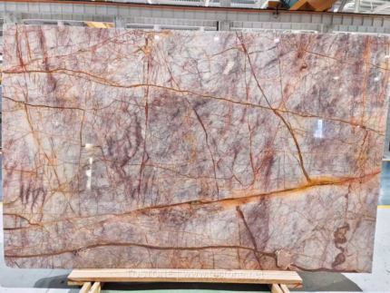 Phoenix Red Marble slab with a gray-blush background, branching burgundy veins and broad golden-ochre lines