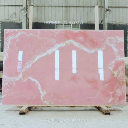 Pink Onyx Marble Slab with broad soft pink areas and flowing cream bands