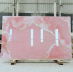 Pink Onyx Marble Slab showing pink centre and irregular creamy-white borders